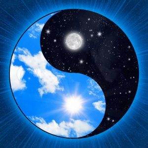 A sun and moon in the shape of an yin yang symbol.
