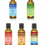 Five seasonal essential oil bottles labeled Winter, Spring, Summer, Autumn, and Fall.