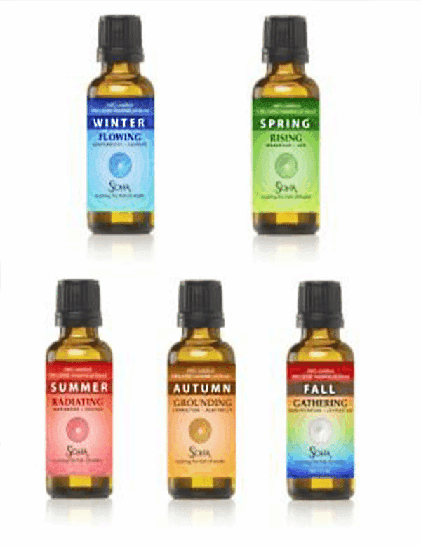 Five seasonal essential oil bottles labeled Winter, Spring, Summer, Autumn, and Fall.